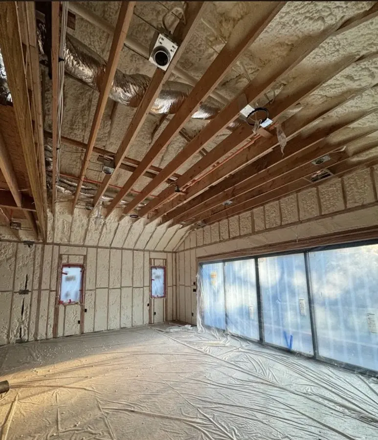 Interior walls and ceiling insulated with spray foam during new construction in Cameron
